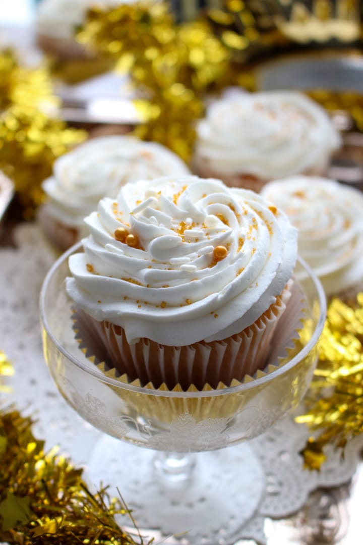 cupcake with icing in a champagne glass