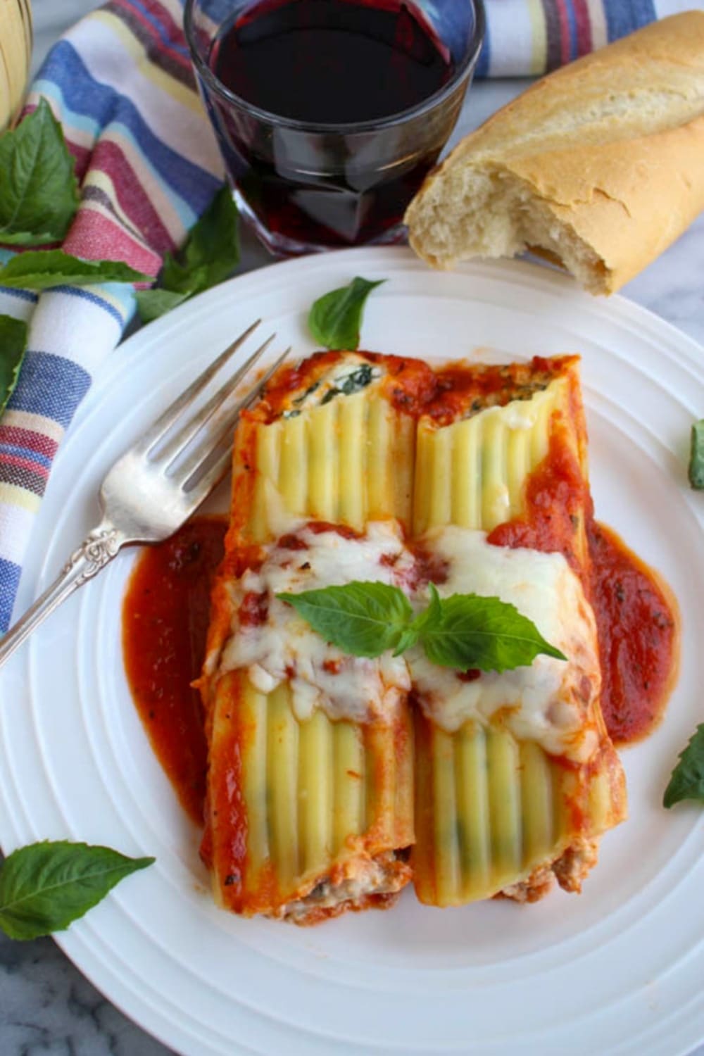 TWO CANNELLONI ON A WHITE PLATE