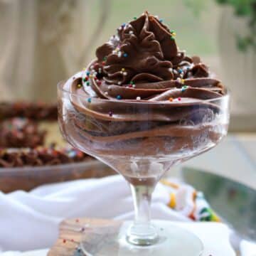a swirl of chocolate frosting in a short fancy dessert dish