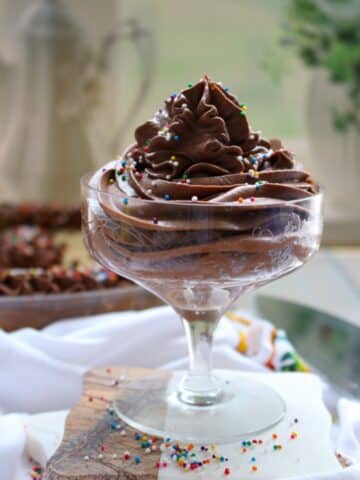 a swirl of chocolate frosting in a short fancy dessert dish