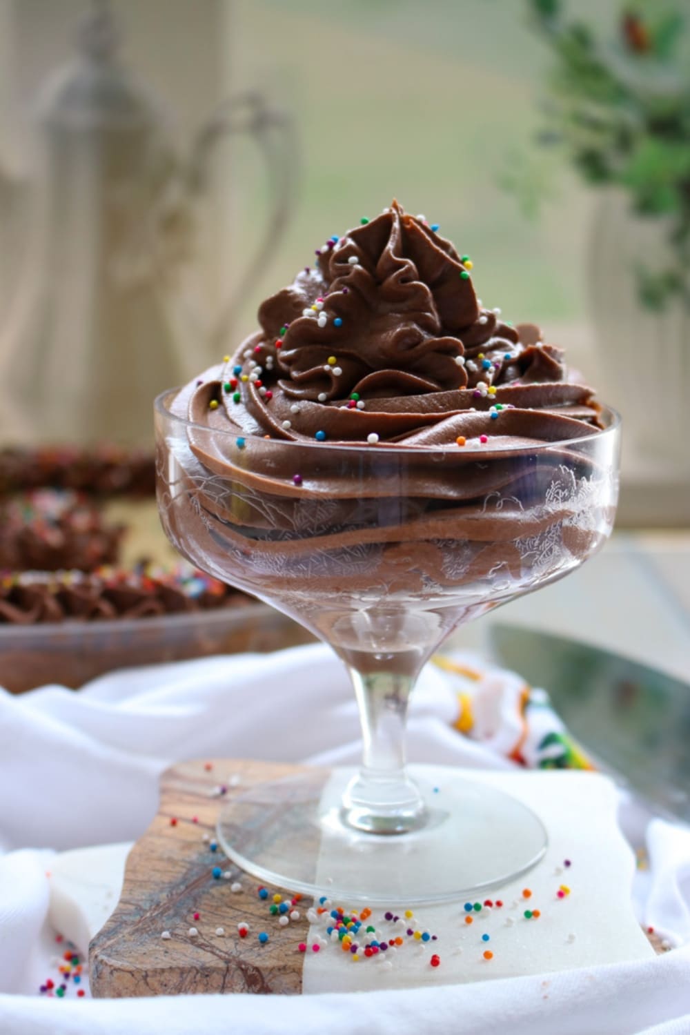 a swirl of chocolate frosting in a short fancy dessert dish