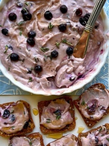 Overhead shot of berry goat cheese bowl and crackers