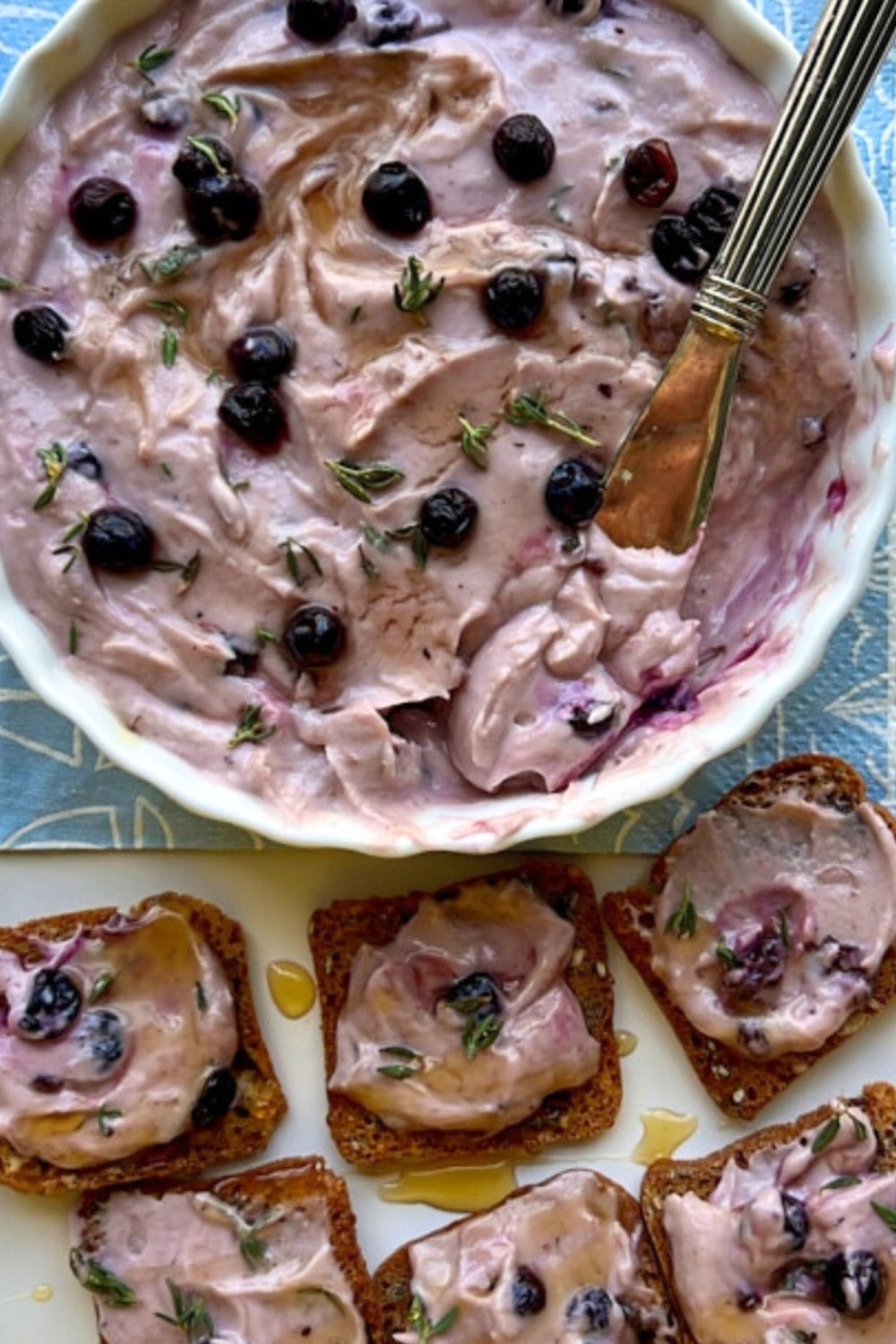 Overhead shot of berry goat cheese bowl and crackers