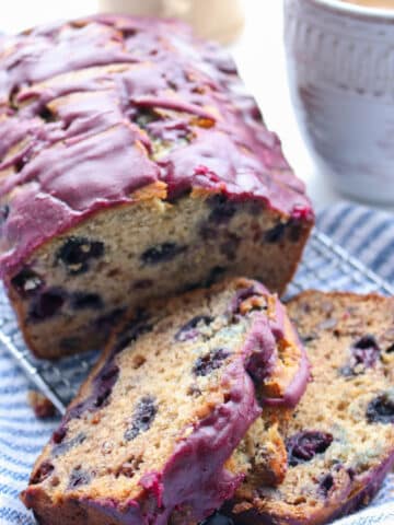 loaf of blueberry banana bread with first two slices