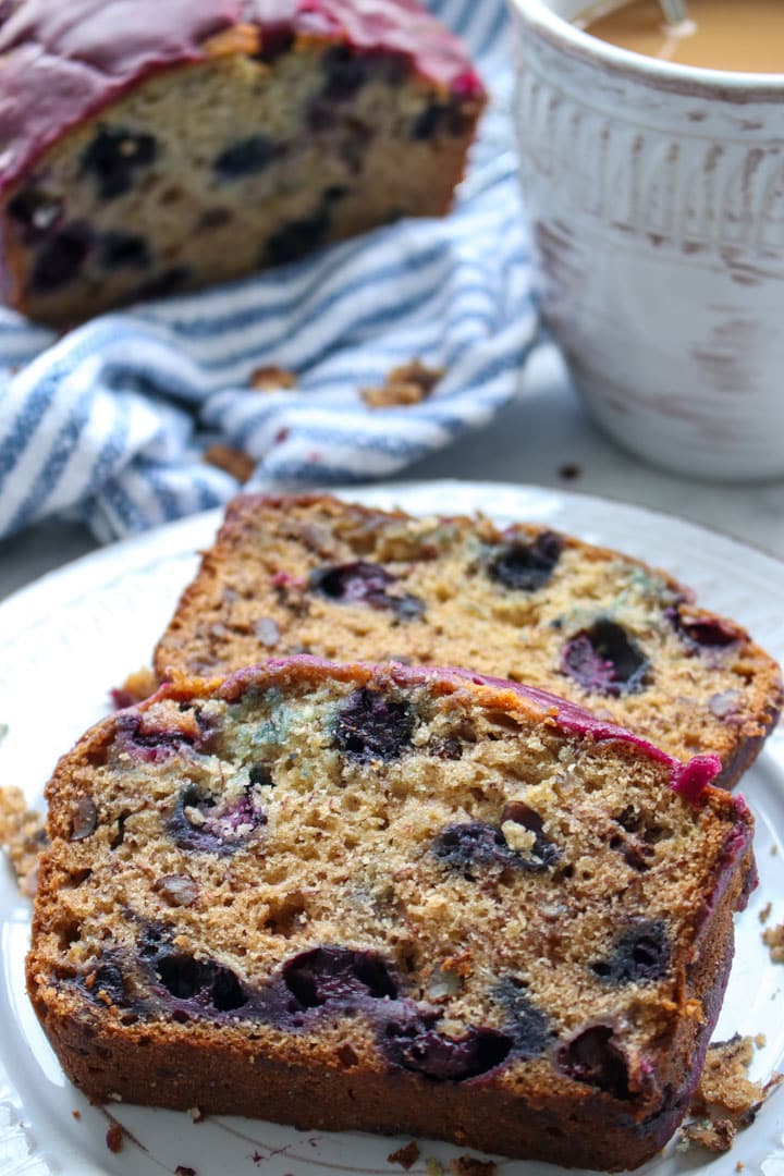 two slices of blueberry walnut bread on a plate