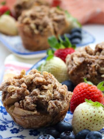 FRENCH TOAST MUFFIN CUP ON A PLATE WITH STRAWBERRIES