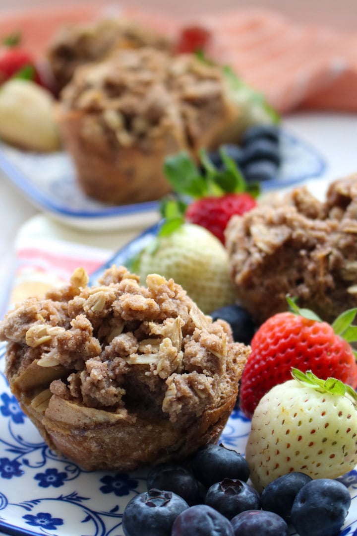 FRENCH TOAST MUFFIN CUP ON A PLATE WITH STRAWBERRIES