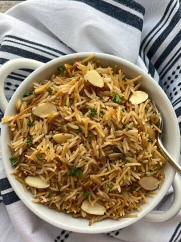 bowl of instant pot rice pilaf with a spooj