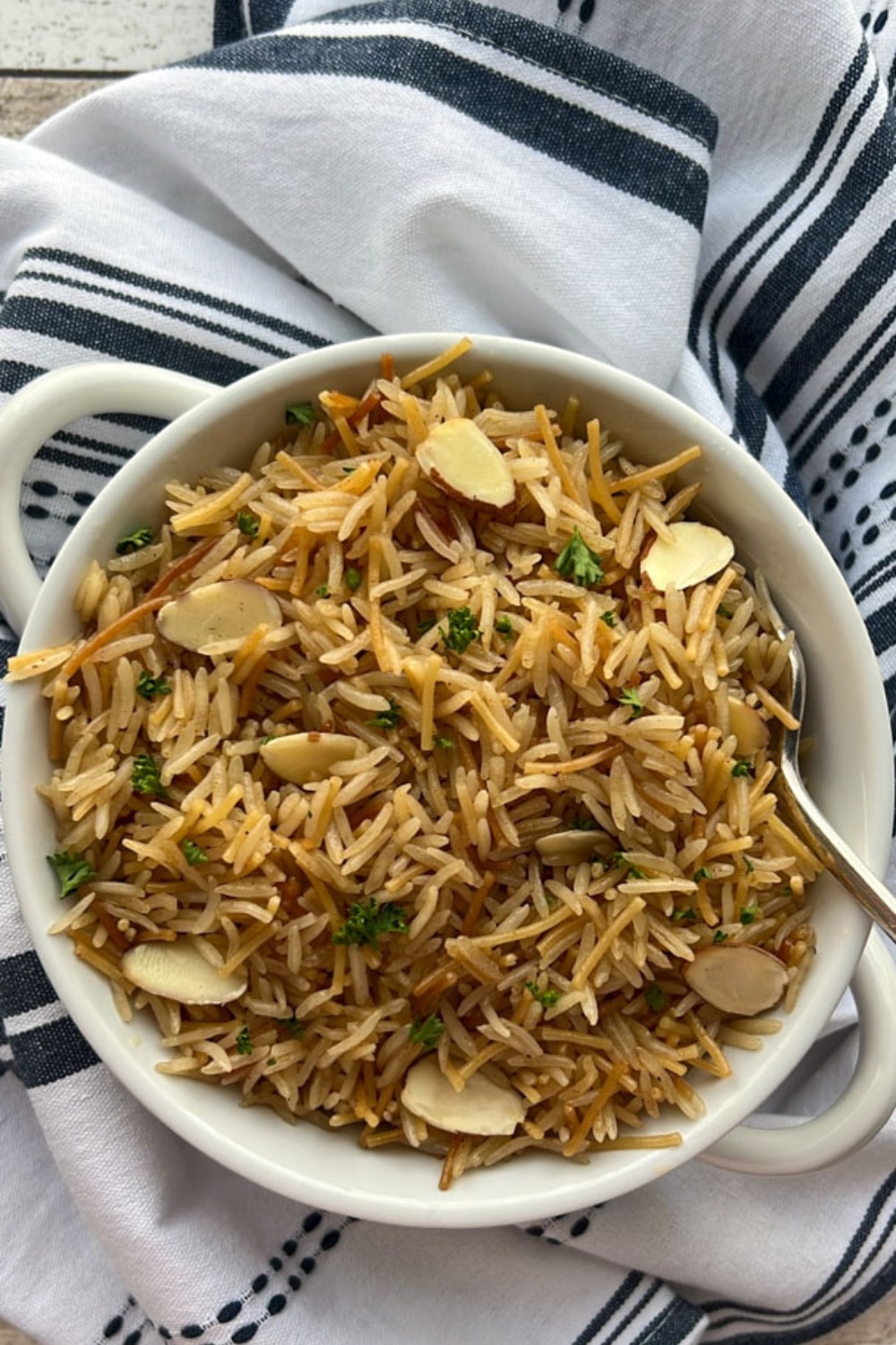 bowl of instant pot rice pilaf with a spooj