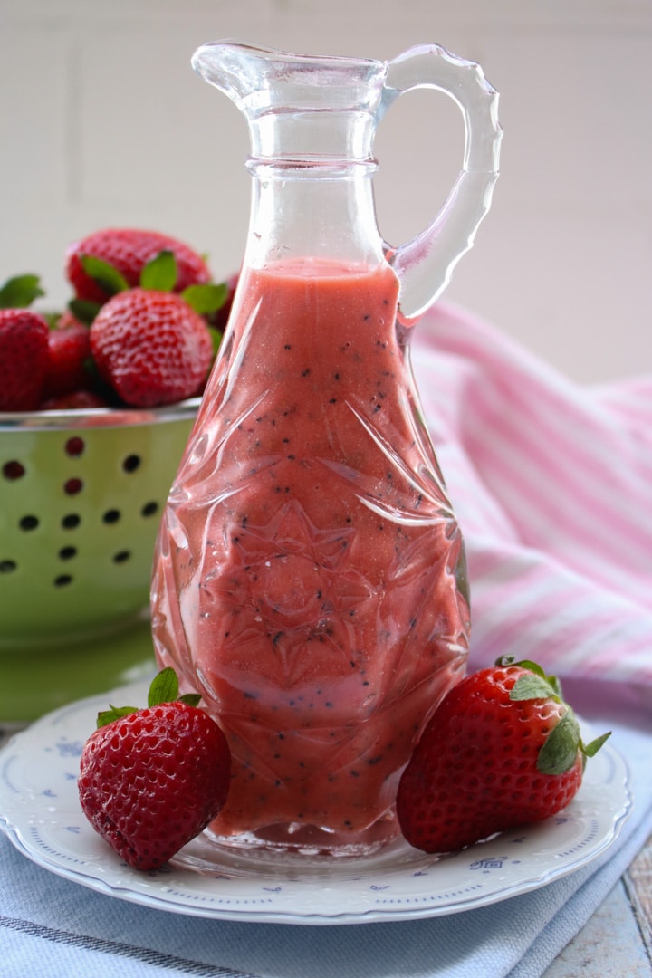carafe of strawberry poppy seed salad dressing