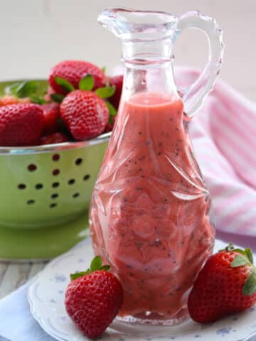 carafe of strawberry poppy seed salad dressing