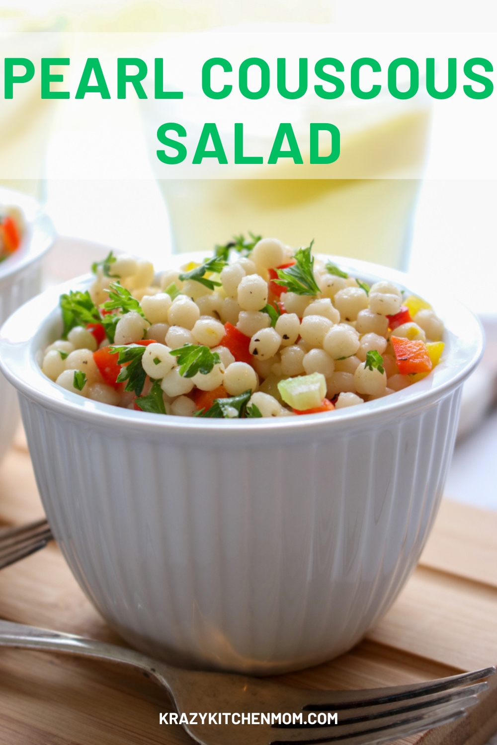 This pearl couscous salad is tossed with crisp vegetables, fresh herbs, and a tangy dressing creating a refreshing summer salad. via @krazykitchenmom