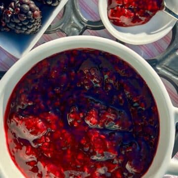 BLACKBERRY JAM IN A BOWL WITH A SIDE OF FRESH BERRIES
