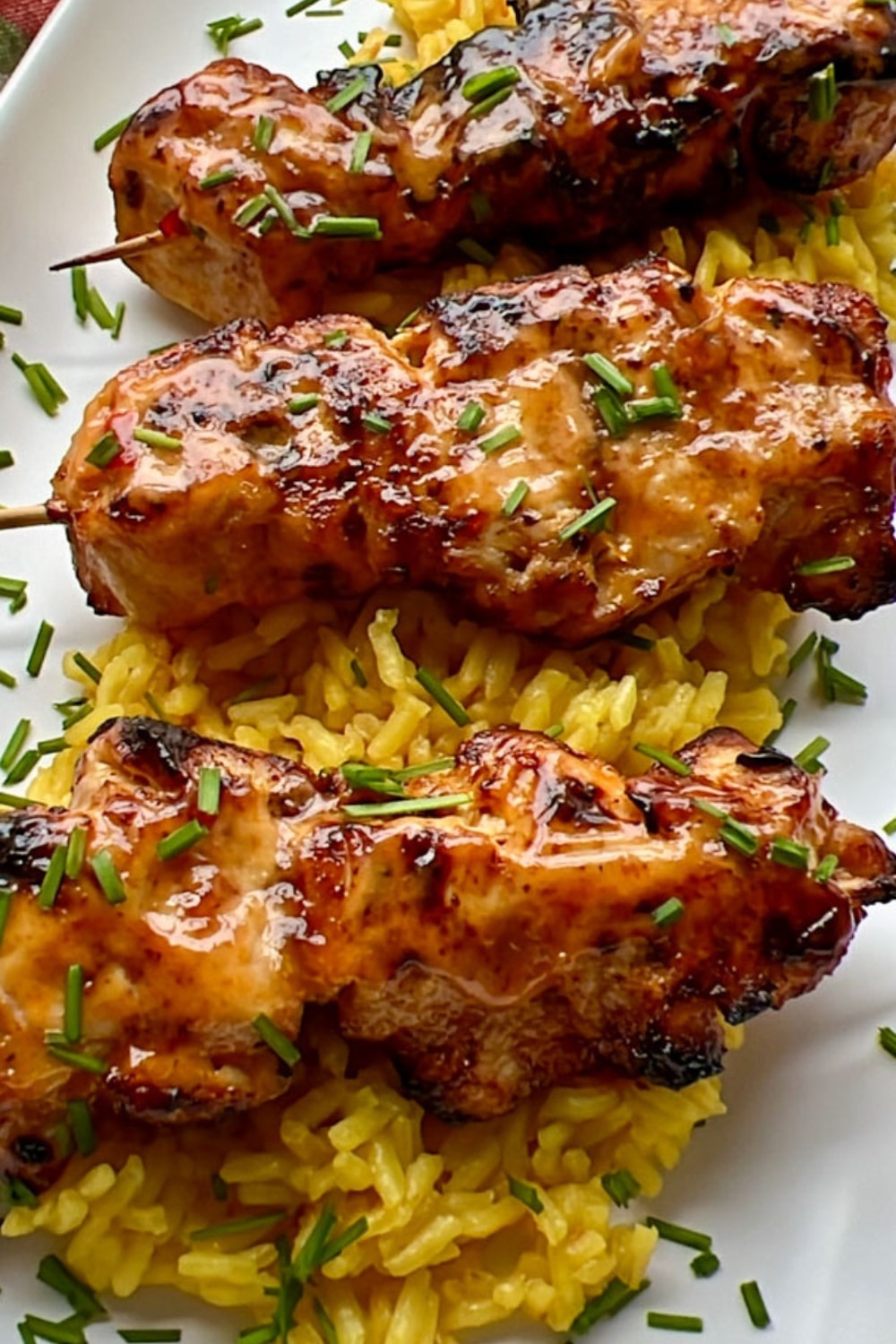 bang bang chicken skewer on yellow rices
