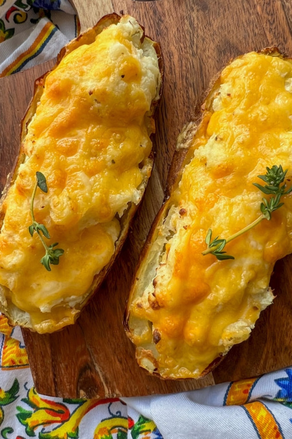 2 air fryer twice baked potatoes on a cutting board