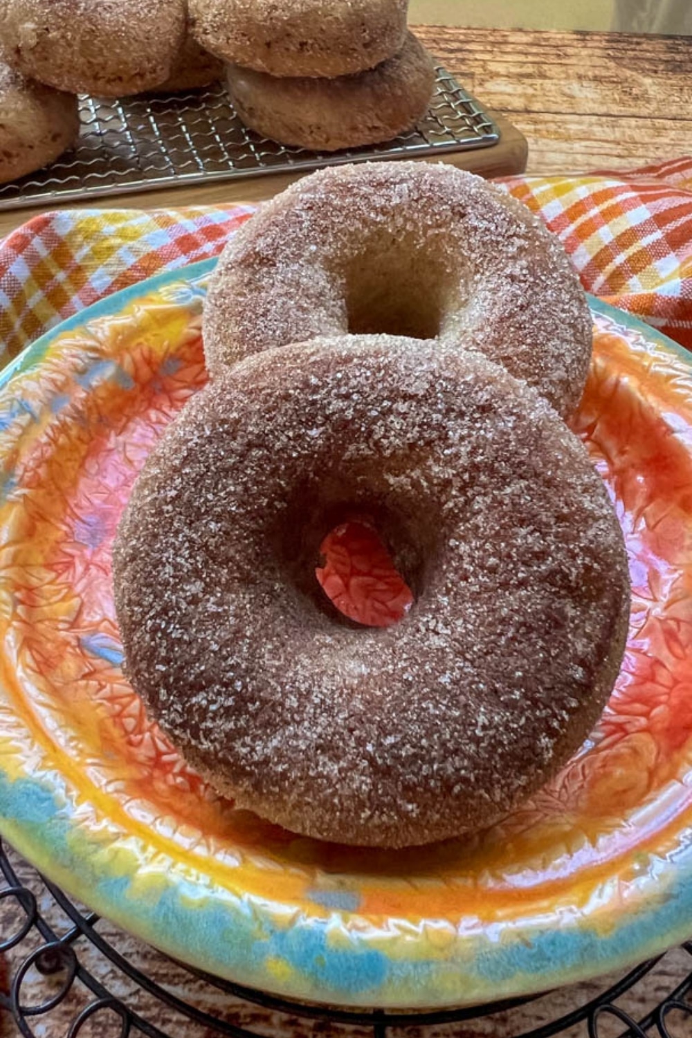 apple cider donuts on an orange plate