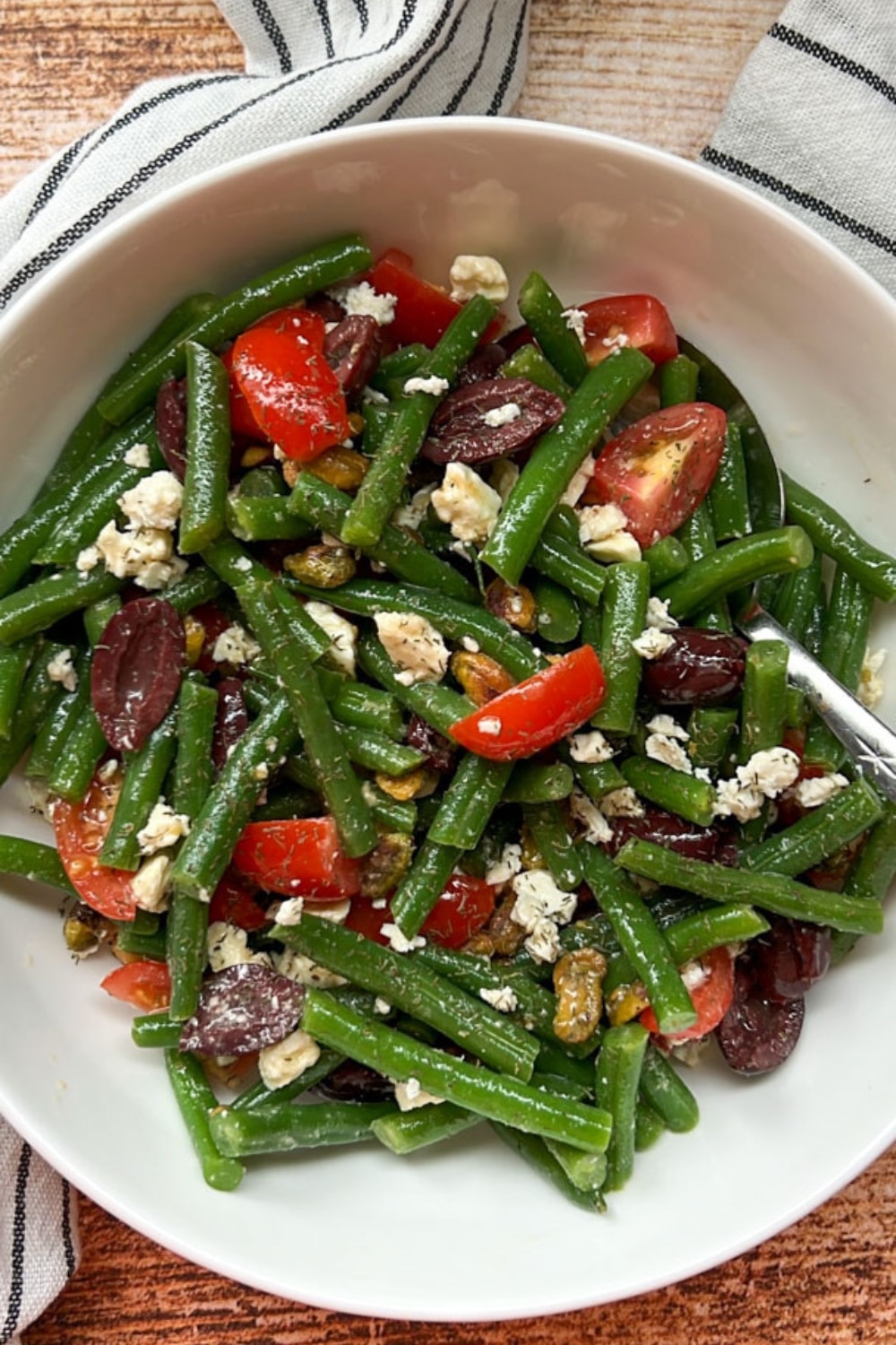 GREEK GREEN BEAN SALAD IN A WHITE BOWL