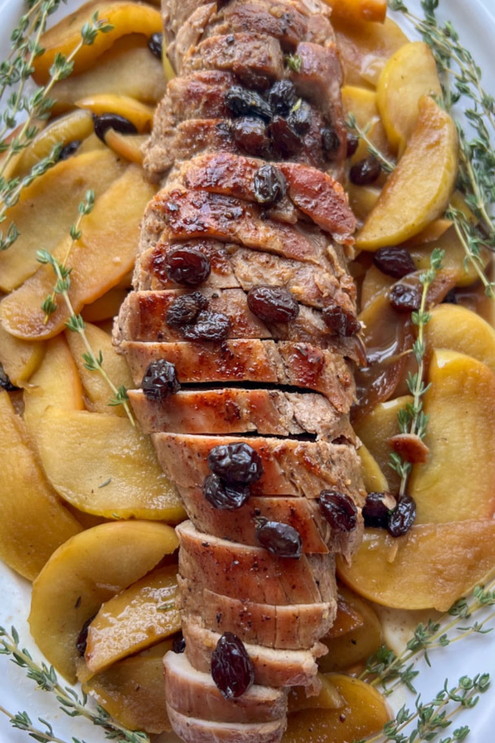 ROASTED PORK TENDERLOIN WITH APPLES ON A SERVING PLATTER