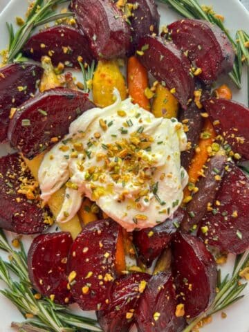 platter of honey maple roasted beets and carrots with burrata cheese