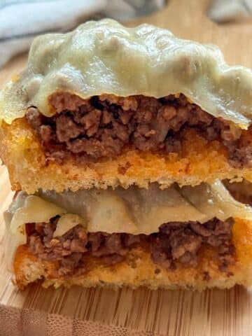 2 SLICES GARLIC BREAD SLOPPY JOES ON STACKED ON TOP OF EACH OTHER