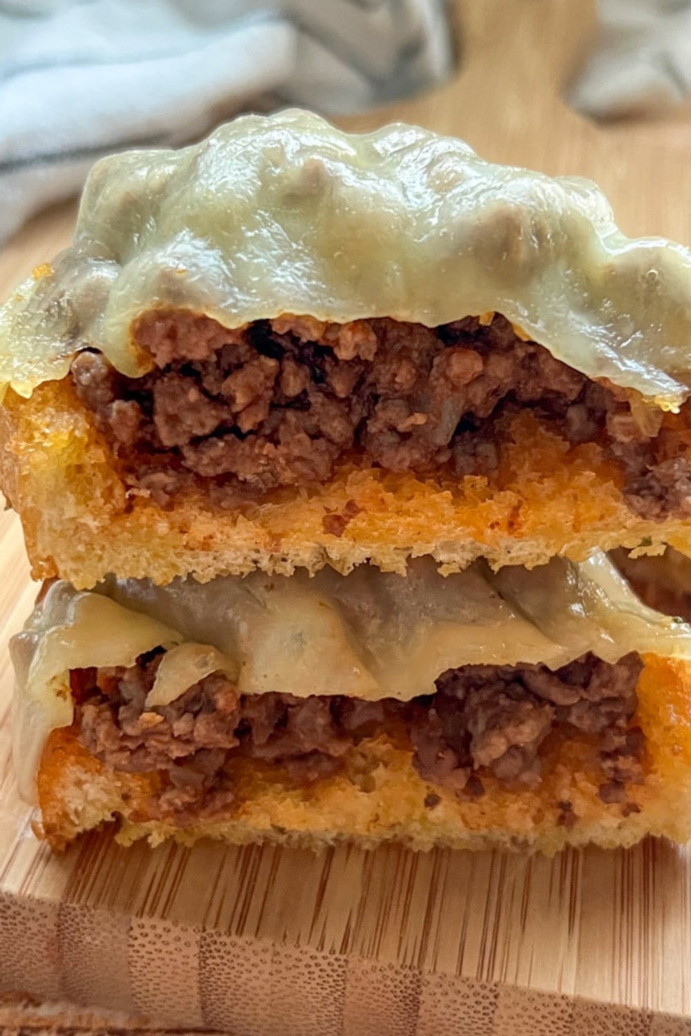2 SLICES GARLIC BREAD SLOPPY JOES ON STACKED ON TOP OF EACH OTHER
