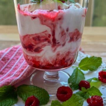 large dessert dish of raspberry fool berries and cream