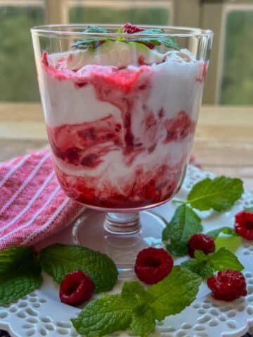 large dessert dish of raspberry fool berries and cream