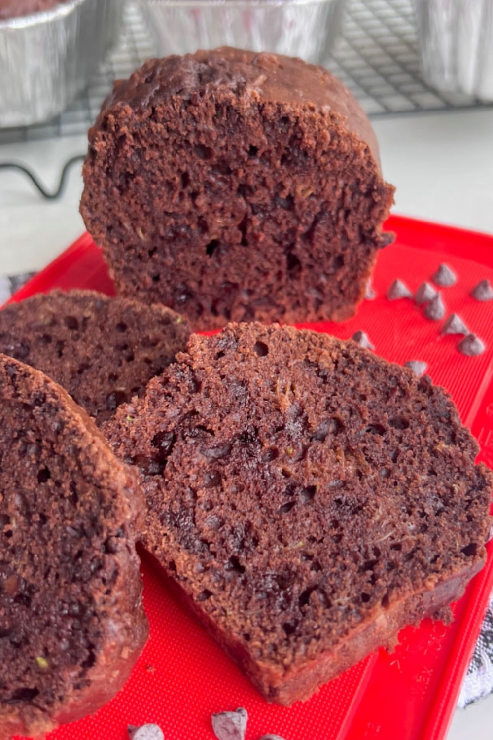 LOAF OF MINI-CHOCOLATE-ZUCCHINI-BREAD SLICES AND ON A PLATE