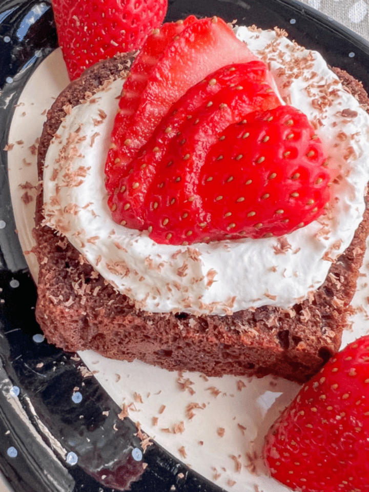 MINI CHOCOLATE ZUCCHINI BREAD TOPPED WITH WHIPPED CREAM, SLICED STRAWBERRIES, AND CHOCOLATE SHAVINGS