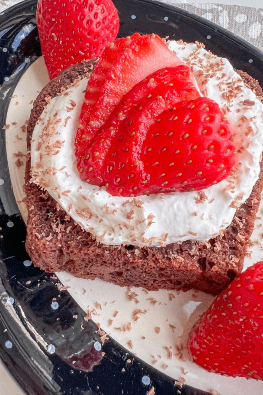 MINI CHOCOLATE ZUCCHINI BREAD TOPPED WITH WHIPPED CREAM, SLICED STRAWBERRIES, AND CHOCOLATE SHAVINGS